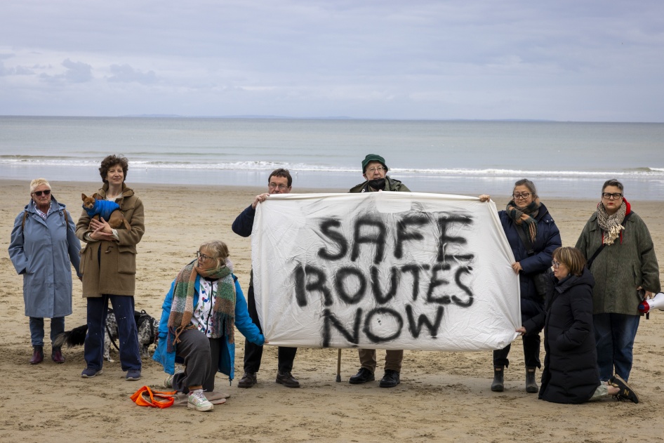 A vigil on Sunny Sands Beach to remember those who have lost their lives crossing the English Channel and to demand safe routes, Folkestone, United Kingdom. 