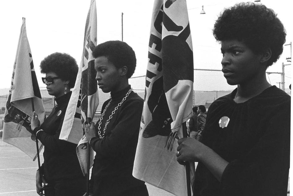 Women holding Panther flags. Photo courtesy of Pirkle Jones and Ruth-Marion Baruch.