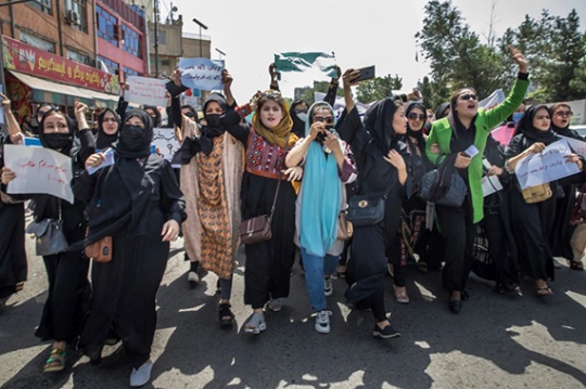 Women take streets in protest. 