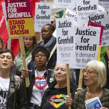 Campaigners hold placards as they take part during the Justice for Grenfell Solidarity rally against the lack of action by the Government following the Grenfell Tower fire, which took the lives of 72 people.