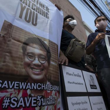 Demonstrators hold photos of Thai activist Wanchalearm Satsaksit and demand information on his whereabouts since his enforced disappearance, at a rally outside the Cambodian embassy in Bangkok, Thailand,  June 8, 2020. 