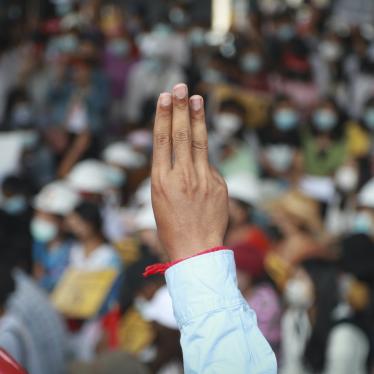 A protester flashes a three-finger salute during an anti-coup protest in Yangon, Myanmar, February 21, 2021.