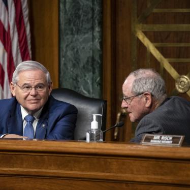 Sen. Robert Menendez of New Jersey, the chairman of the Senate Foreign Relations Committee (left), speaks with Sen. Jim Risch of Idaho, during a Senate Foreign Relations committee hearing.