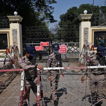  Prison officials outside of Insein prison in Yangon, February 12, 2022. 