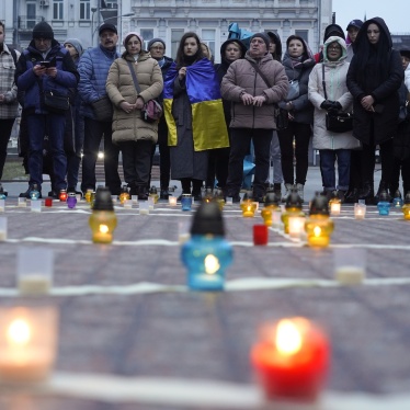 People in Kyiv, Ukraine, commemorate victims killed at the Mariupol Drama Theater a year after Russian airstrikes hit the building, where hundreds of civilians, including children, were sheltering. March 16, 2023.