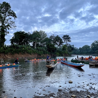 SENAFRONT officers coordinate the departure of “piraguas,” wooden canoes made from hollowed-out tree trunks