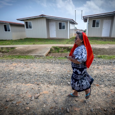 A Guna Indigenous woman walks in Isber Yala, the site where her new, safer house was built in Guna Yala Comarca, Panama, August 30, 2023. 