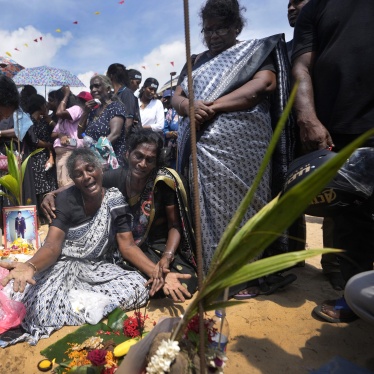 A Tamil woman cries for her deceased family members during a civil war remembrance in Mullivaikkal, Sri Lanka, May 17, 2024.