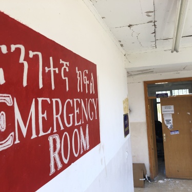 A sign that reads "Emergency Room" in a hospital 
