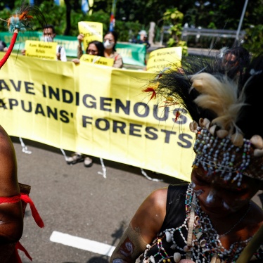 Activists protest against deforestation by palm oil companies on Indigenous land in Papua, outside the Supreme Court in Jakarta, Indonesia, May 27, 2024. 