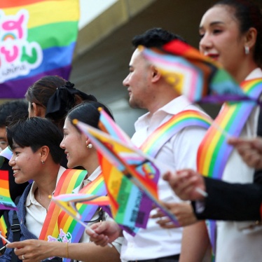 People in Bangkok hold rainbow flags celebrating the passage of Thailand’s Marriage Equality Act, June 18, 2024.