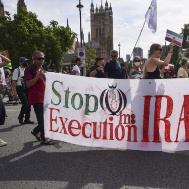 Protesters hold a banner reading 'Stop execution in Iran' during a march in Parliament Square, London, September 16, 2023. 