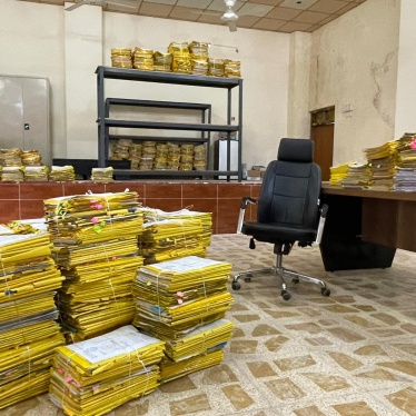 Piles of applications in the Tel Afar compensation office. 