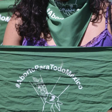 Green handkerchiefs displayed at a rally