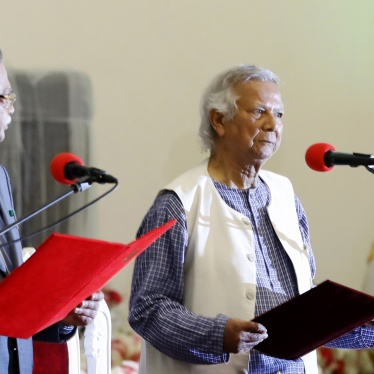 Nobel laureate Muhammad Yunus, right, takes the oath of office as the head of Bangladesh's interim government in Dhaka, Bangladesh, August 8, 2024.