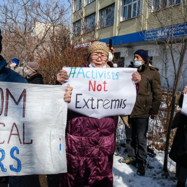 Protesters hold placards during an opposition rally