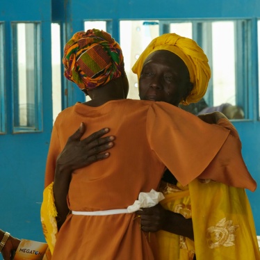 A witness embraces counsel at the Gambian Truth, Reconciliation and Reparations Commission, which called for the prosecution of former President Jammeh, the “Junglers” and others for alleged crimes, in Eassau, Gambia. 