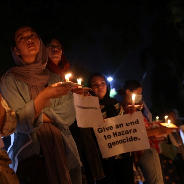 Members of Afghanistan’s Hazara community protest a suicide attack at a tutoring center in Kabul outside the UN refugee agency’s office in New Delhi, India, September 30, 2022.