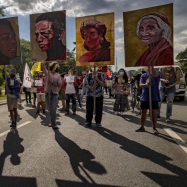 Climate activists hold up portraits of slain Philippine environmental defenders during the Global Day of Action for Climate Justice protest in Quezon City, Philippines, November 6, 2021.