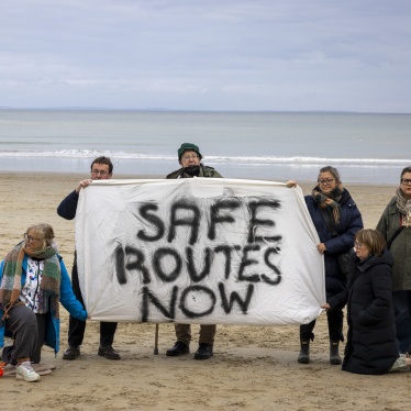 A vigil on Sunny Sands Beach to remember those who have lost their lives crossing the English Channel and to demand safe routes, Folkestone, United Kingdom. 