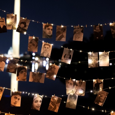 A display of photos that includes protesters executed by the Iranian government at a candlelight vigil honoring Mahsa Zhina Amini and the demonstrators, in Washington DC, September 16, 2023.