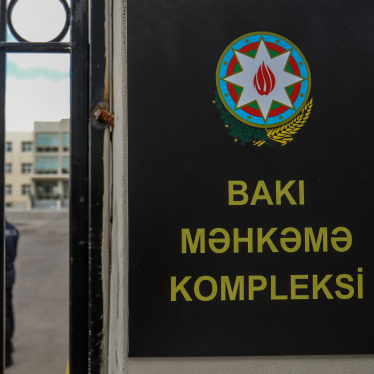 Police officers stand outside a courthouse on January 21, 2025, in Baku, Azerbaijan. 