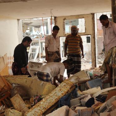 Men dig through rubble in a residential compound housing employees of the Mokha Steam Power Plant and their families following an airstrike by the Saudi-led coalition that killed at least 57 civilians in Mokha, Yemen on July 24, 2015. 