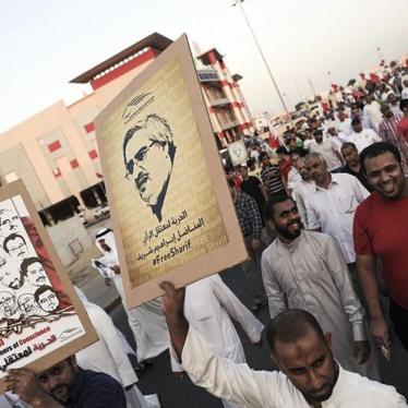 Protesters hold posters with pictures of political activist Ibrahim Sharif and other political prisoners as they march to demand their release during a rally organized by Bahrain's main opposition group Al Wifaq in Al A'aali village, Bahrain on November 1