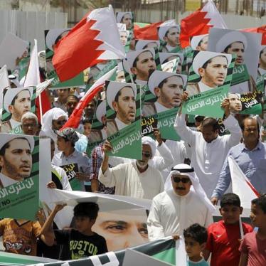 Protesters holding photos of Bahrain's main opposition leader Ali Salman march during an anti-government protest in the village of Diraz, west of Manama, Bahrain on June 12, 2015. 