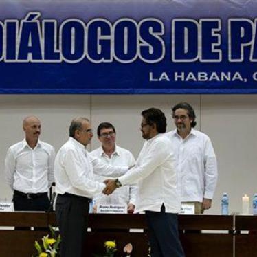 Humberto de la Calle, chief negotiator of Colombia’s government, shakes hands with Iván Márquez