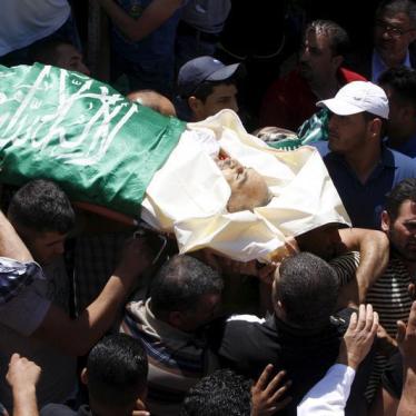 Mourners carry the body of Palestinian man Falah Abu Marya, 53, during his funeral in the village of Beit Ummar near the West Bank city of Hebron July 23, 2015