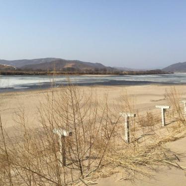 A barbed-wire fence separating North Korea from China is seen in this photo taken from the Chinese border city of Hunchun, China on March 18, 2015.