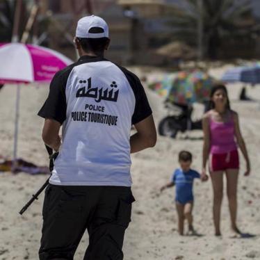 A tourist police officer patrols at the beach near the Imperiale Marhaba hotel, which was attacked by a gunman in Sousse, Tunisia on July 1, 2015. 