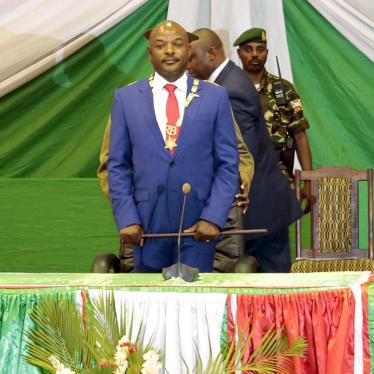President Pierre Nkurunziza stands after being sworn in for a third term. Bujumbura, Burundi, August 20, 2015. 