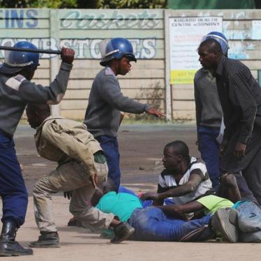 Riot police detain residents of Epworth suburb after a protest by taxi drivers turned violent in Harare, Zimbabwe, July 4, 2016.