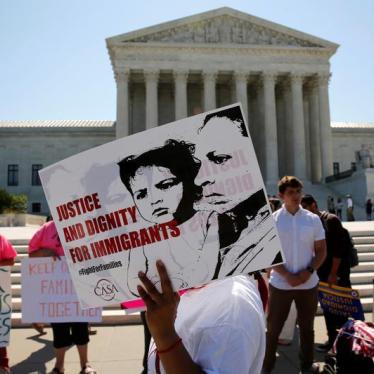 Demonstrators from the immigrant community advocacy group CASA carry signs as they march in the hopes of a ruling in their favor on decisions at the Supreme Court building in Washington, U.S. June 20, 2016.