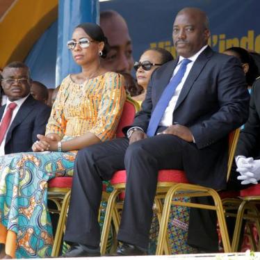 Kalev Mutond, Director of the National Intelligence Agency (ANR) in the Democratic Republic of Congo, sits to the right of First Lady Marie Olive Lembe and President Joseph Kabila during the country’s independence anniversary celebration in Kindu, capital
