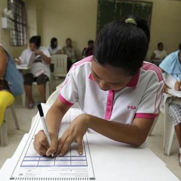Voters fill out official ballots during the May 2010 presidential elections in the Philippines.