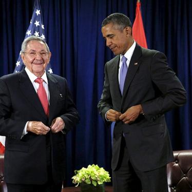 U.S. President Barack Obama and Cuban President Raul Castro unbutton their jackets at the start of their meeting at the United Nations General Assembly in New York on September 29, 2015. 