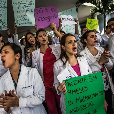 Doctors protest in front of the state-run University City Hospital in Caracas carrying signs describing patients they have not been able to help because they lack necessary supplies, January 15, 2015.