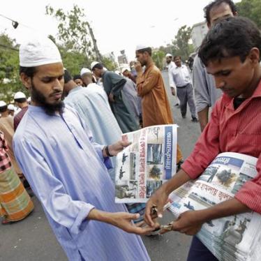A man buys a local newspaper in Dhaka, Bangladesh on March 20, 2011.