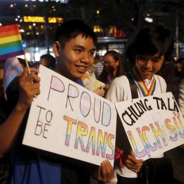 Demonstration participants pose with signs that read "Proud to be transgender" in Hanoi, Vietnam. (c) 2015 Reuters