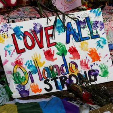 A sign of support is pictured at a memorial for the victims of the mass shooting at the Pulse nightclub in Orlando, Florida. ©2016 Reuters.