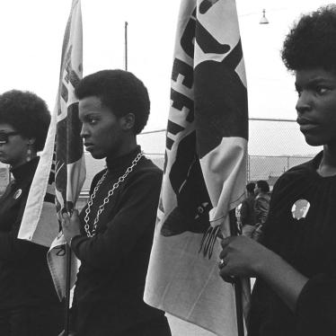 Women holding Panther flags. Photo courtesy of Pirkle Jones and Ruth-Marion Baruch.
