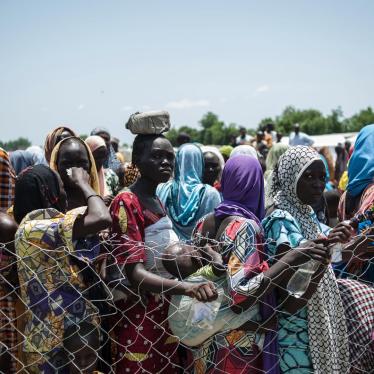 Women and children queue on September 15, 2016 to enter a nutrition clinic at an informal settlement in the outskirts of Maiduguri, the capital of Borno State, in northeastern Nigeria.