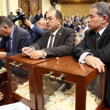 Tawfik Okasha, right, looks on at a vote to choose the head of the Egypt's Parliament late in Sunday's procedural and opening session at the main headquarters of Parliament in Cairo, Egypt, January 10, 2016. 