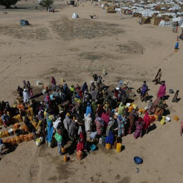 Women and children gather at the water point at an internally displaced people’s camp in Maiduguri