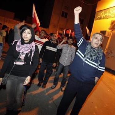 Zainab al-Khawaja (front L), daughter of human rights activist Abdulhadi al-Khawaja, and fellow human rights activist Nabeel Rajab (R) take part in a rally held in support of Abdulhadi al-Khawaja in the village of Bani-Jamra, west of Manama March 11, 2012