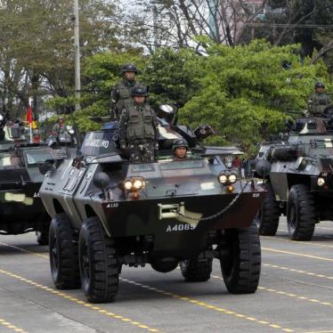 Government troops stand atop of armoured personnel carriers during the celebration of the 77th founding anniversary of the Armed Forces of the Philippines (AFP) inside the Camp Aguinaldo military headquarters in Quezon city, metro Manila December 21, 2012