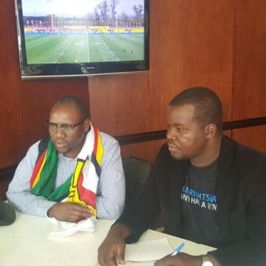 Pastor Evan Mawarire of the #ThisFlag campaign (Left) meets with Human Rights Watch Senior researcher Dewa Mavhinga in Johannesburg, South Africa, August 2016.